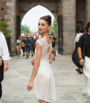 Dance leotard with deep boat neckline. Ballerina in front of a castle.